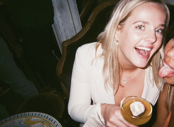 Friends laughing over cocktails