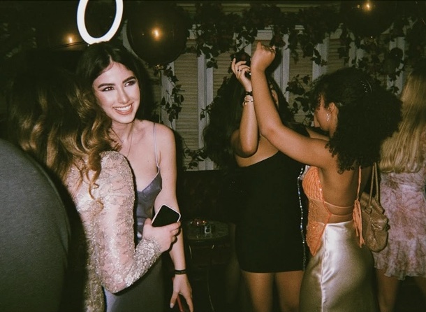 Dancing beneath balloons