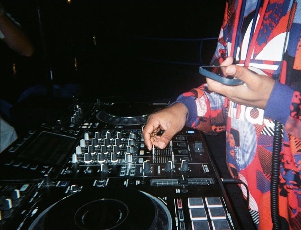 A DJ at the mixing desk
